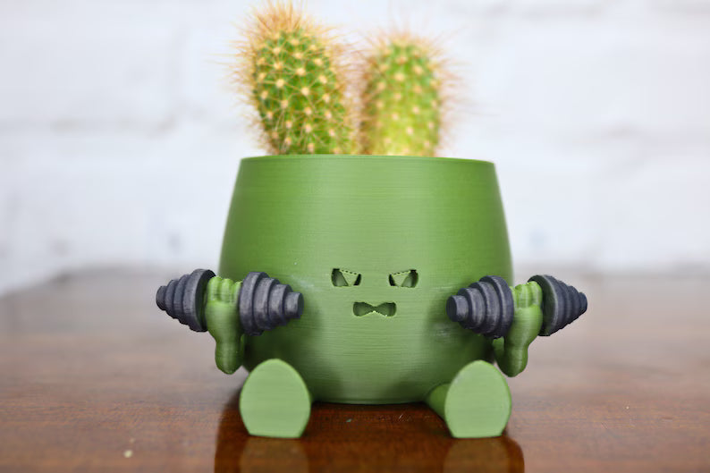 Vaso creativo verde a forma di personaggio con cactus decorativo
