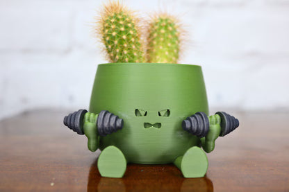 Vaso creativo verde a forma di personaggio con cactus decorativo